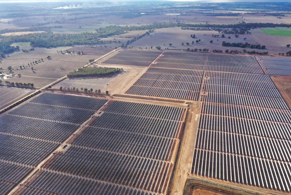 Photo: An aerial image of an extensive solar panel array in the countryside